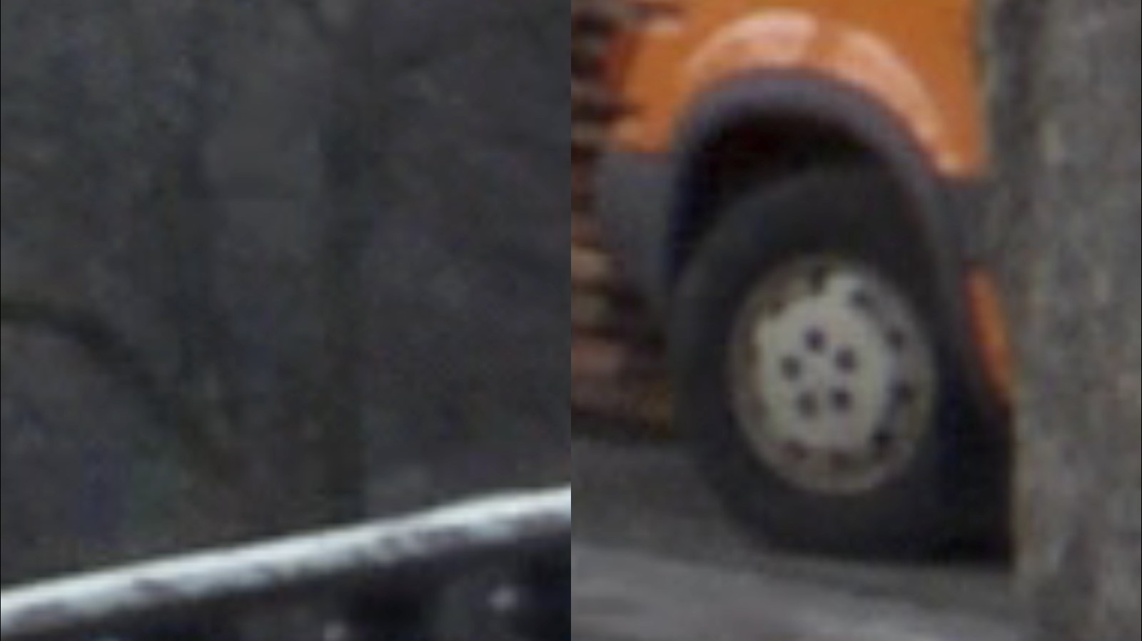 Photogramme à l'agrandissement extrême, presque abstrait : à gauche une surface grise indistincte barrée d'une ligne claire, à droite la roue d'un camion orange.